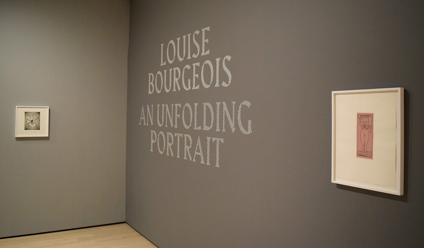 The entrance to Louise Bourgeois: An Unfolding Portrait at the Museum of Modern Art with "Femme Maison" ("Woman House," 1984), photogravure at right