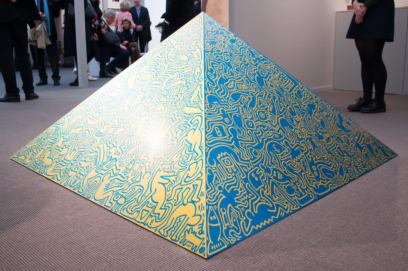 Keith Haring, "Pyramid Sculpture" (1989), aluminum, anodized, mounted on wooden plinth, 56.69 x 56.69 x 29.53 in (photo by Maria Victoria Recinto)
