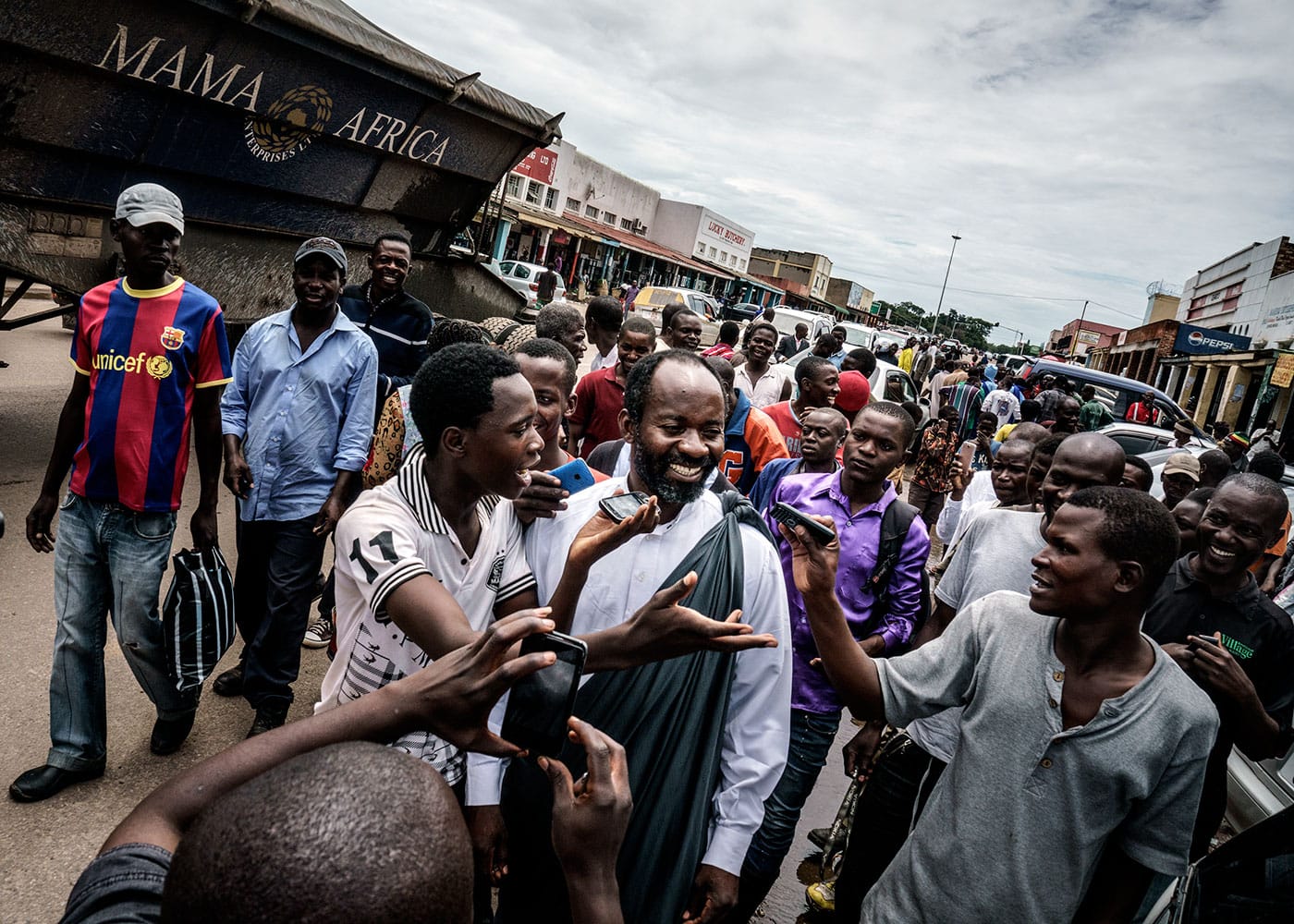 "Jesus of Kitwe (born Mupeta Chishimba) proselytizing in a marketplace. Big crowds gather, recording his every word on their mobile phones." (Zambia, 2015), photograph by Jonas Bendiksen from <em>The Last Testament</em> (courtesy Aperture, © Jonas Bendiksen/Magnum Photos)