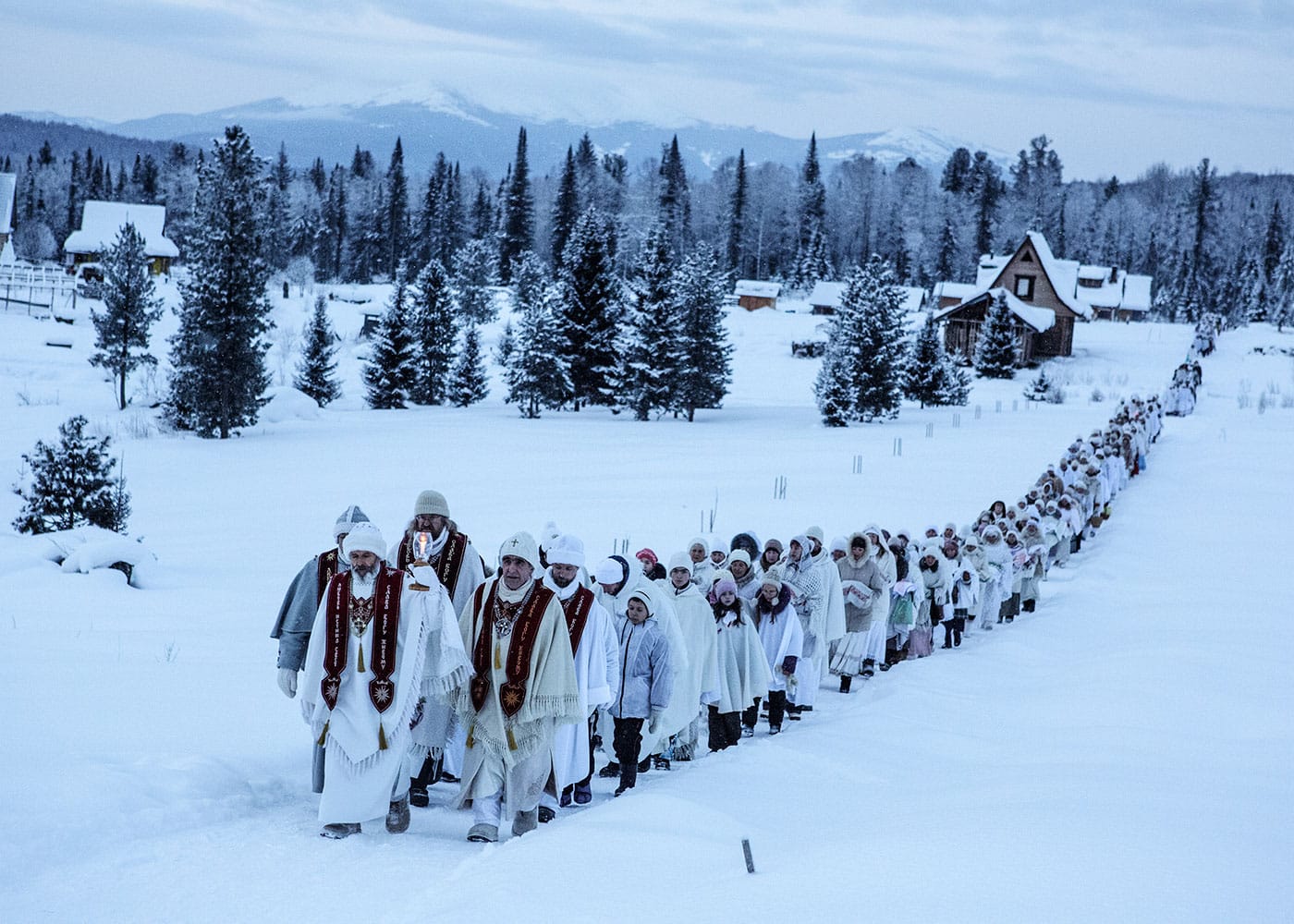 "On January 14th, Vissarion's birthday, his disciples enter the community's innermost and holiest village, Obitel Rassveta, or The Abode of Dawn. This date is known as the true Christmas to his followers, and is celebrated by big communal processions and ceremonies." (Russia, 2015), photograph by Jonas Bendiksen from <em>The Last Testament</em> (courtesy Aperture, © Jonas Bendiksen/Magnum Photos)
