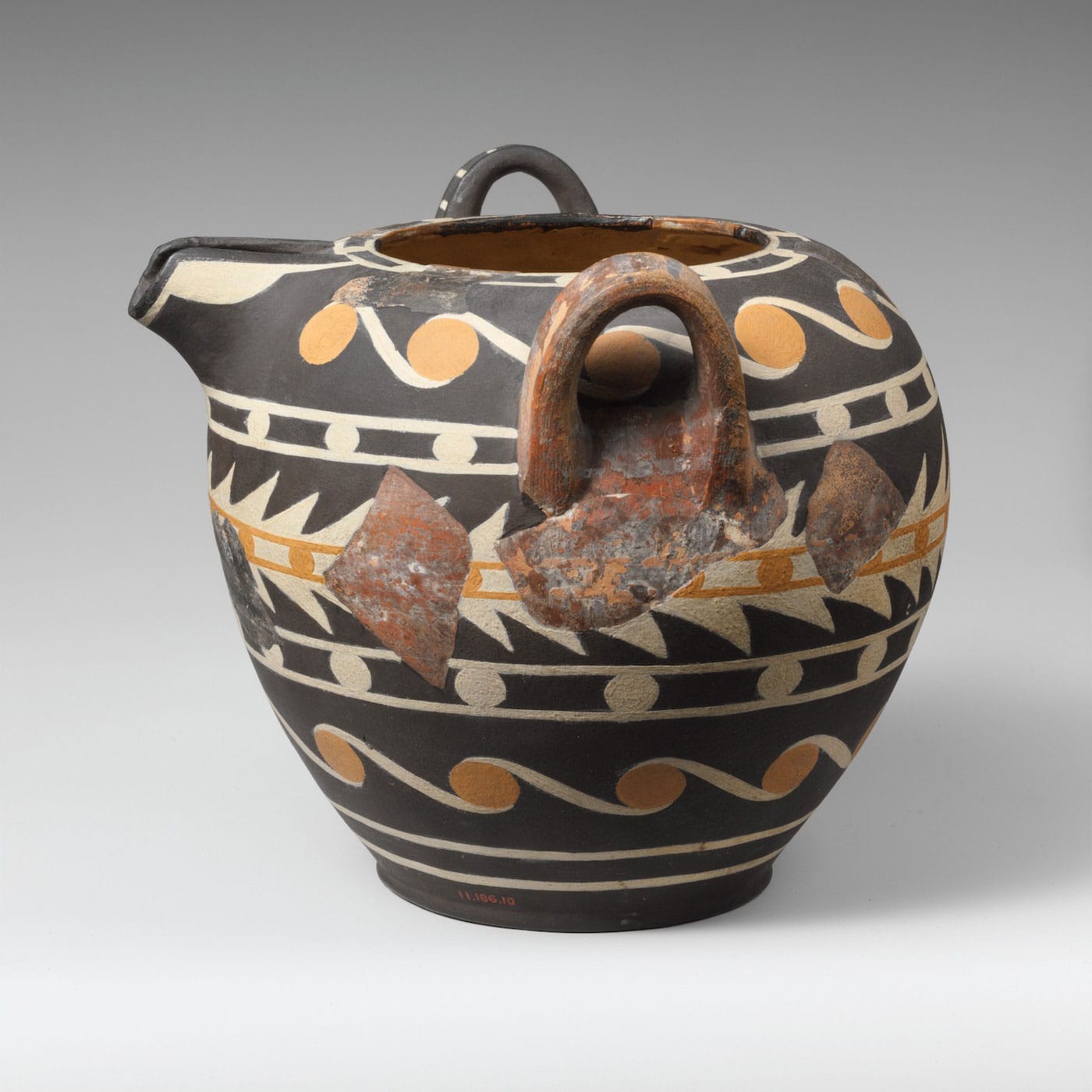 Restored Kamares Ware Terracotta Bridge-Spouted Jar (Middle Minoan II–III Period, 1900–1600 BCE), terracotta, Knossos (courtesy the Metropolitan Museum of Art, New York, gift of Ashmolean Museum, by exchange)