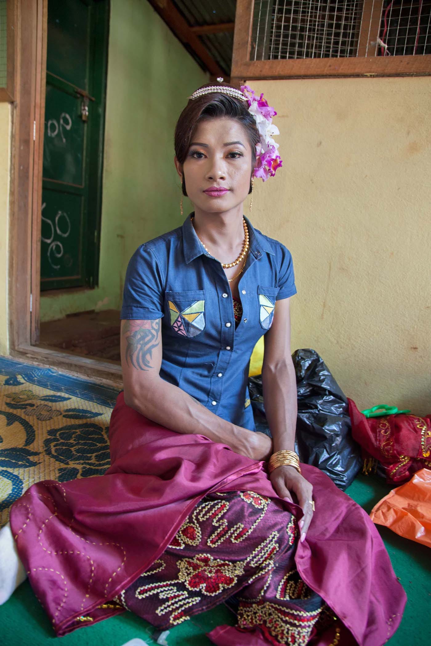 "A gender variant tattooed and muscular nat kadaw in Mount Popa waits to perform at a nat pwe." (© Mariette Pathy Allen, from <em>Transcendents: Spirit Mediums in Burma and Thailand</em>, courtesy Daylight Books)