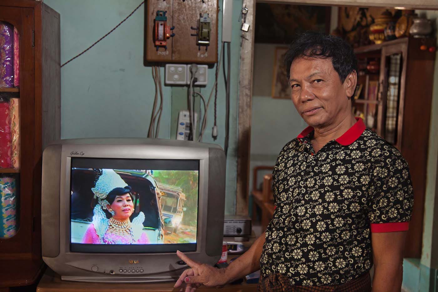 "Mot Me Noe, a famous nat kadaw in Mandalay, showing the video of their performance at a spirit festival." (© Mariette Pathy Allen, from <em>Transcendents: Spirit Mediums in Burma and Thailand</em>, courtesy Daylight Books)