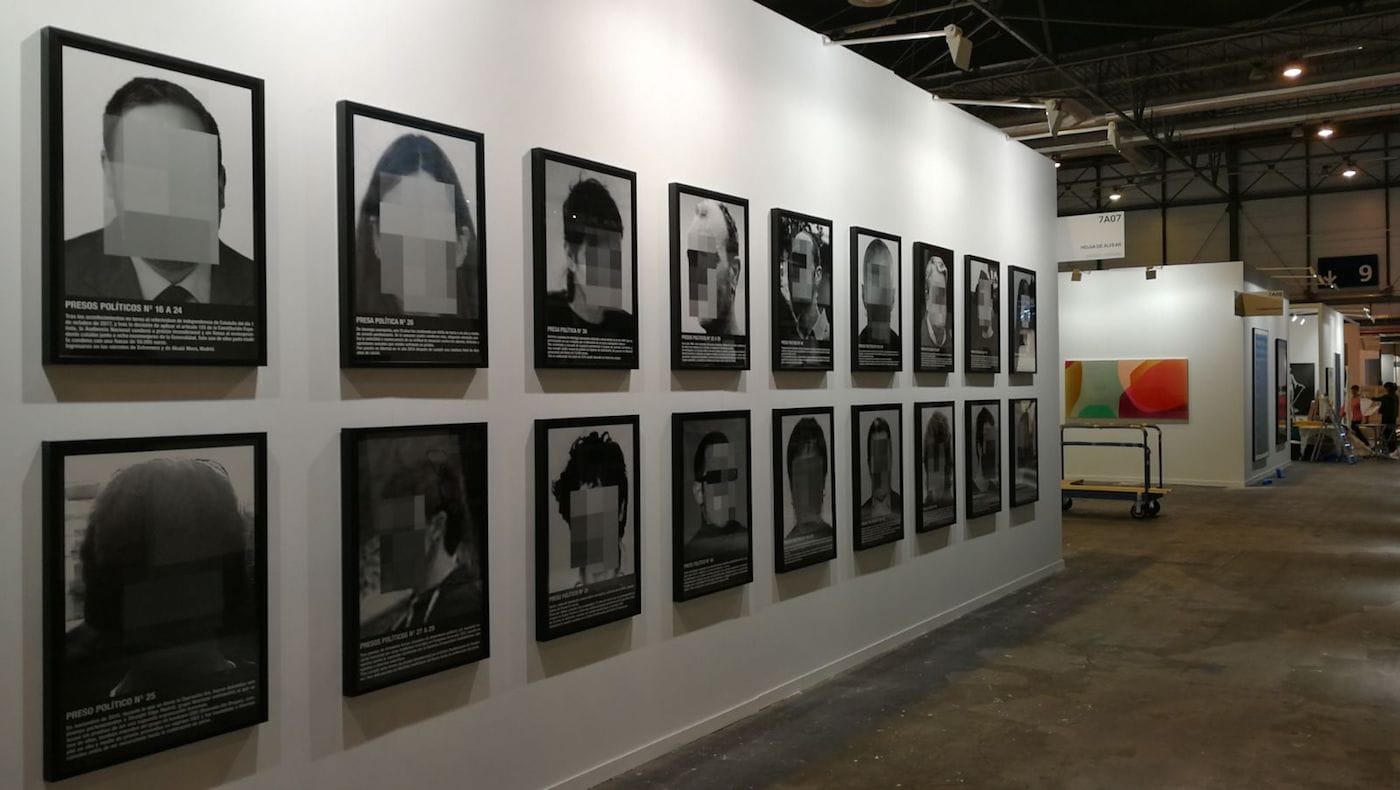 Santiago Sierra, "Political Prisoners in Contemporary Spain" (2018) on view at the Helga de Alvear booth during the installation of Madrid's ARCO art fair (courtesy the artist and Helga de Alvear)