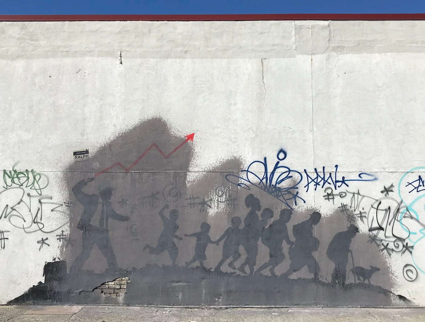 The larger of Banksy's two Midwood murals as it appeared on March 24, 2018, partially obscured by gray paint