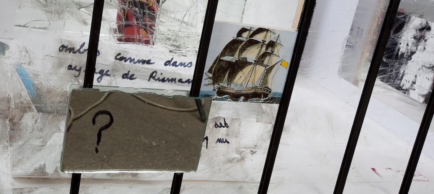 Jean-Luc Godard, "The Real (reverie)" (2004–06, detail), foamcore, wood, Plexiglass, watercolor, paper collage, mirrored glass, felt pen hand written text by Godard (written backwards), and mixed media, Rainbow Transvideo monitor, 15 x 33 7/8 x 37 in (courtesy of Miguel Abreu Gallery)