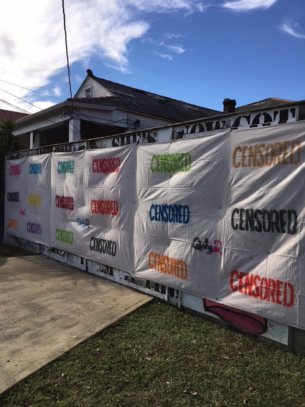 Cashy-D's "censored" tarp over his anti-Trump mural in New Orleans (photo courtesy and © Neal Morris)
