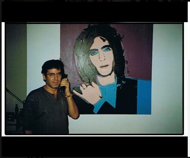 Todd Rassner with his 1975 portrait by Andy Warhol in a photo from circa 1994 (screenshot by the author via Facebook)