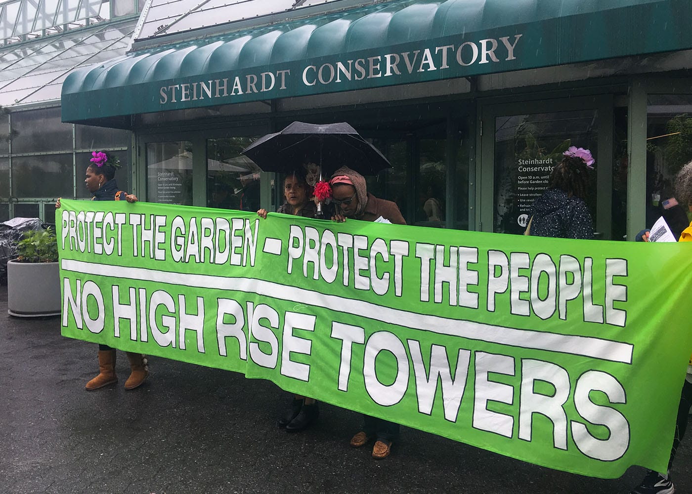 Protesters gathered outside the Steinhardt Conservatory as Brooklyn Botanical Garden employees locked the front doors.