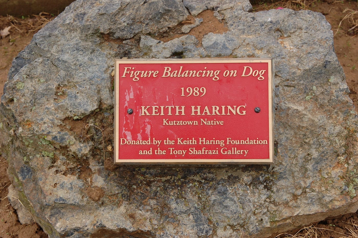 The plaque at the foot of Keith Haring's sculpture in Kutztown Park