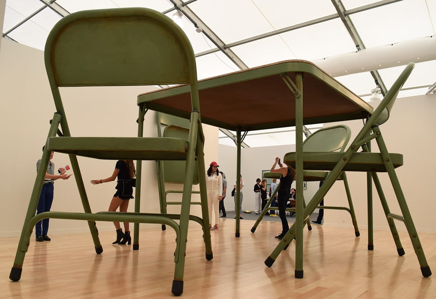 Robert Therrien, "No title (folding table and chairs, green)" (2008) in one of the Gagosian booths at Frieze New York