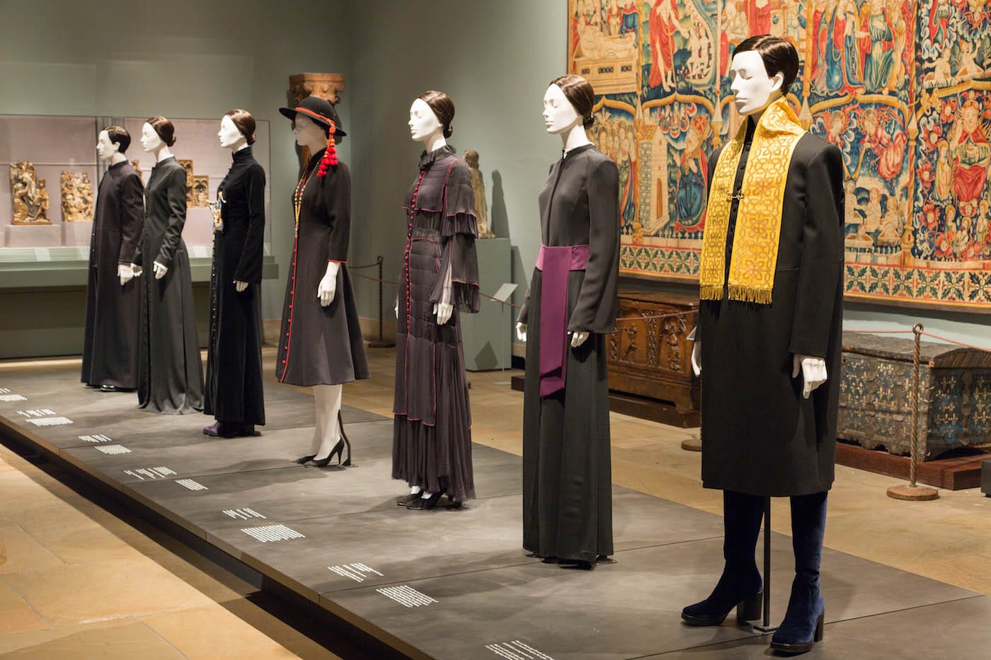 Installation view of <em/>Heavenly Bodies: Fashion and the Catholic Imagination in the Medieval Sculpture Hall
