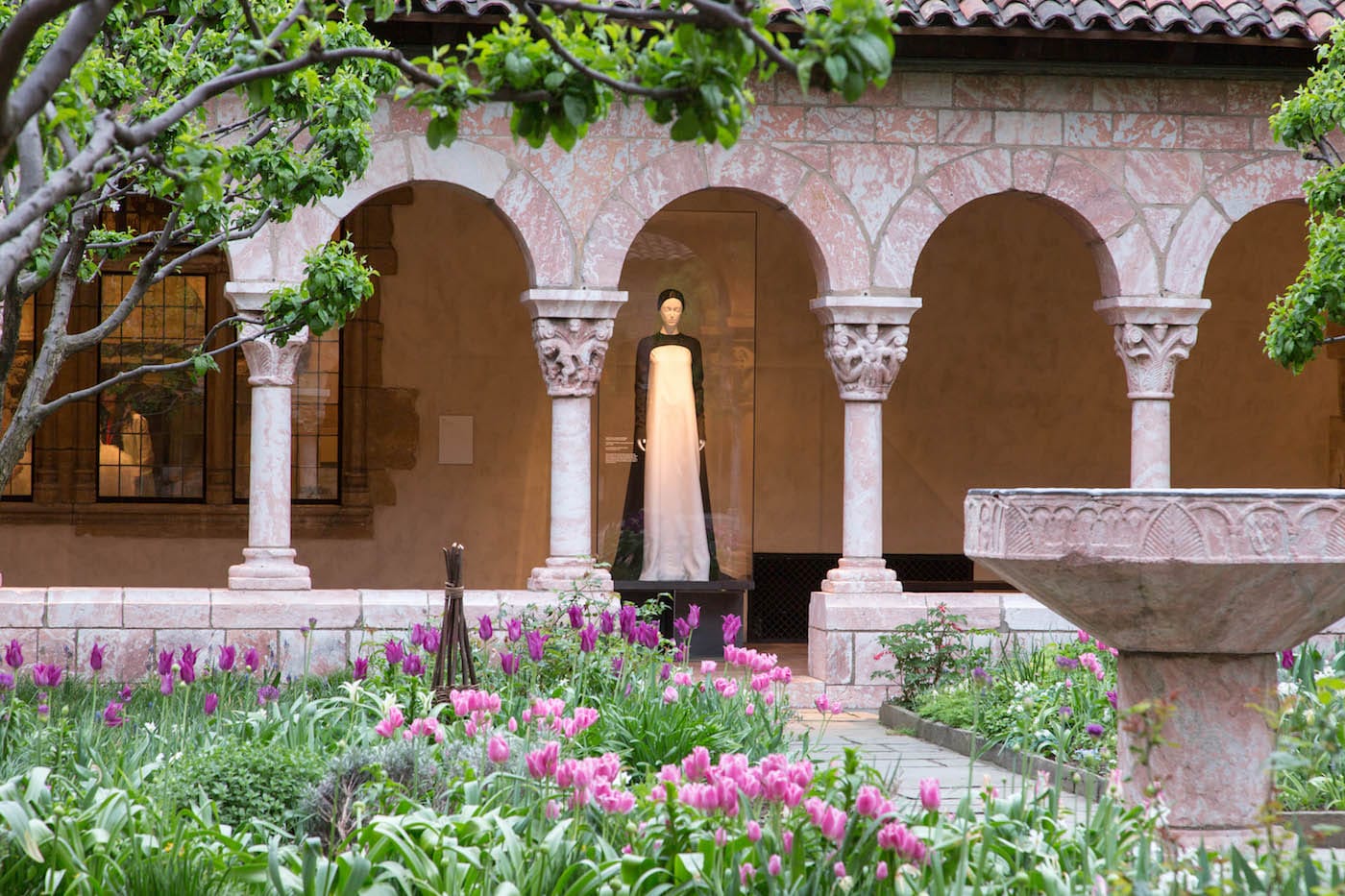 Installation view of <em/>Heavenly Bodies: Fashion and the Catholic Imagination in the Cuxa Cloister