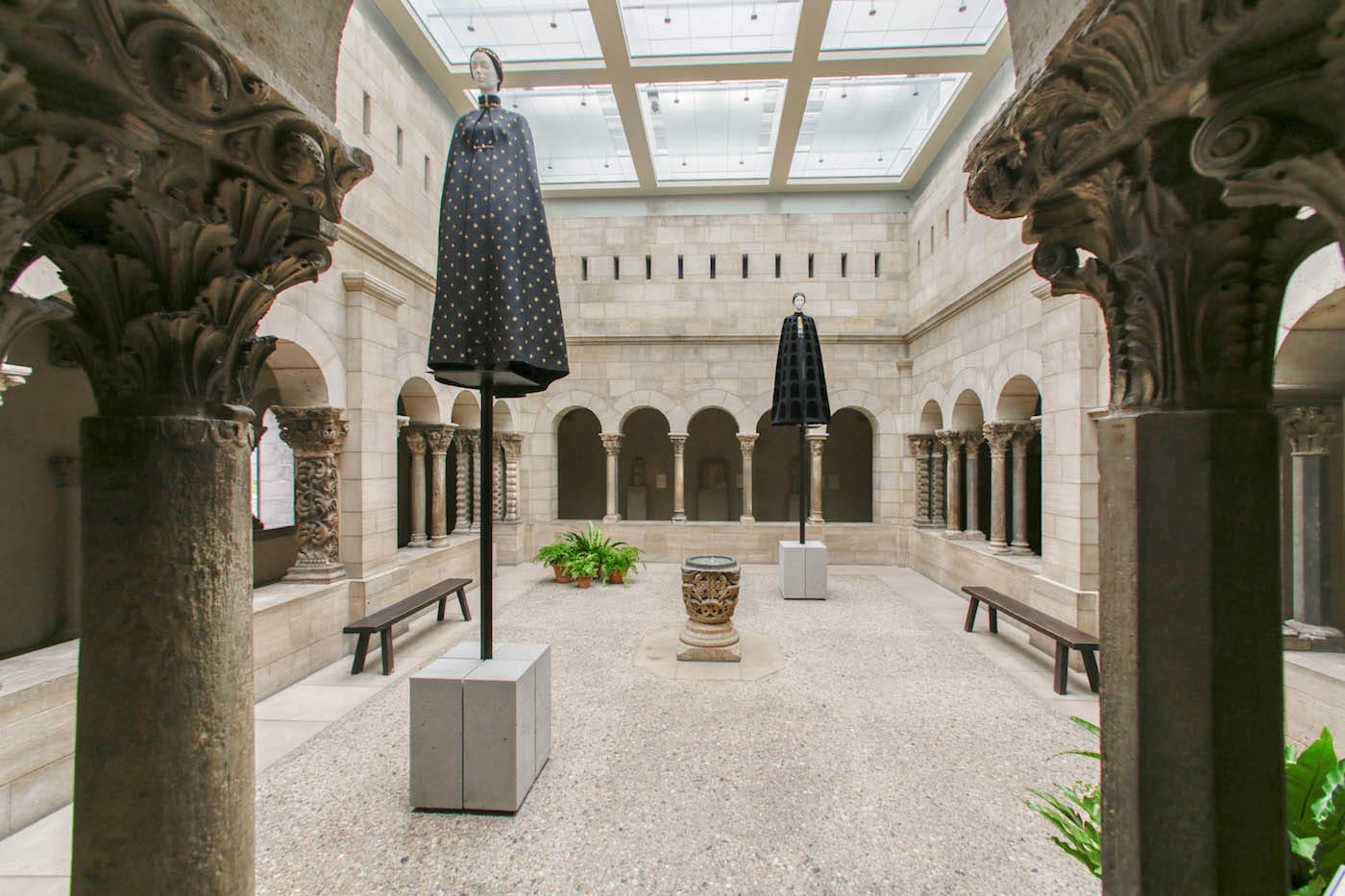 Installation view of <em/>Heavenly Bodies: Fashion and the Catholic Imagination in the Saint-Guilhem Cloister
