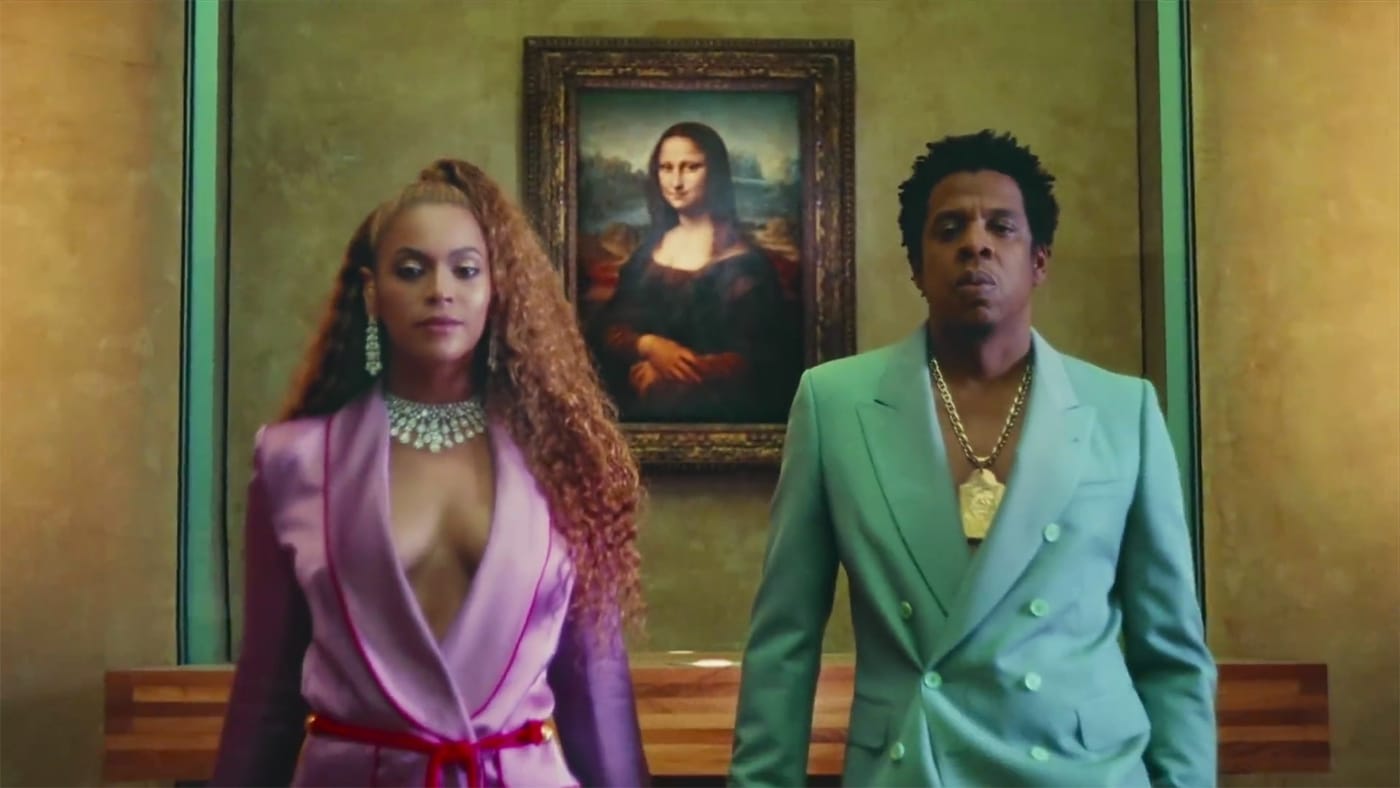 Beyoncé and Jay-Z in front of Leonardo da Vinci's Mona Lisa in the video for "Apeshit" (all screenshots by the author via YouTube)