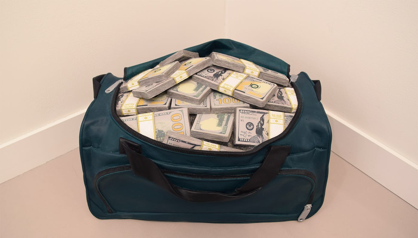 Matt Johnson, "Movie Money (1.75 Million Dollars in a Gym Bag)" (2018), carved wood with paint, 13 x 21 x 15 in, in 303 Gallery's booth at Frieze New York 2018 (photo by the author for Hyperallergic)