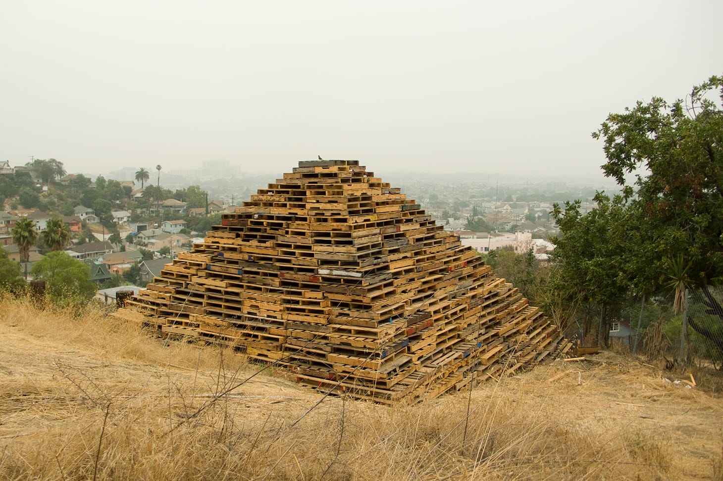 Liz Glynn, "III" (2010), reclaimed forklift pallets, 9 performances, 27 x 27 x 17 ft., Los Angeles, CA