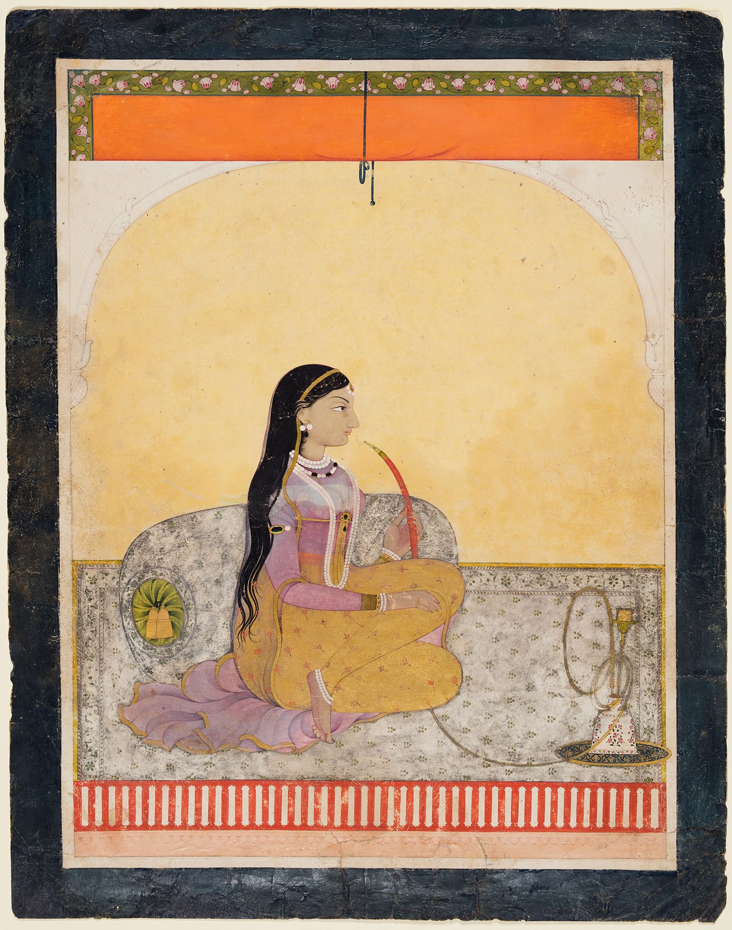 "Seated Lady Smoking a Hookah" (c. 1780), Northern India, Himachal Pradesh, Pahari Kingdom of Guler, opaque watercolor and gold on paper, 12 11/16 x 10 inches (purchase and partial gift from the Catherine and Ralph Benkaim Collection; Severance and Greta Millikin Purchase Fund; image courtesy Cleveland Musem of Art)