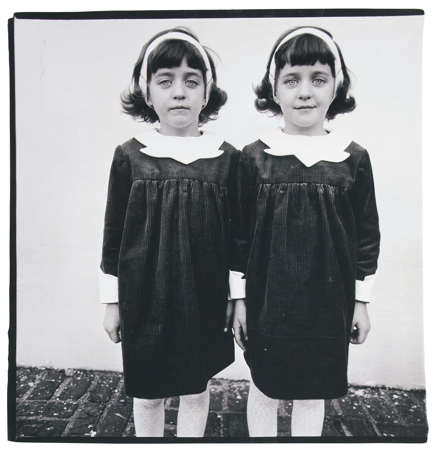Diane Arbus, "Identical twins, Roselle, N.J., 1966" (printed 1966–1969), gelatin silver print, image: 15 x 14 1/2 inches, sheet: 20 x 16 inches (image courtesy Christie's)
