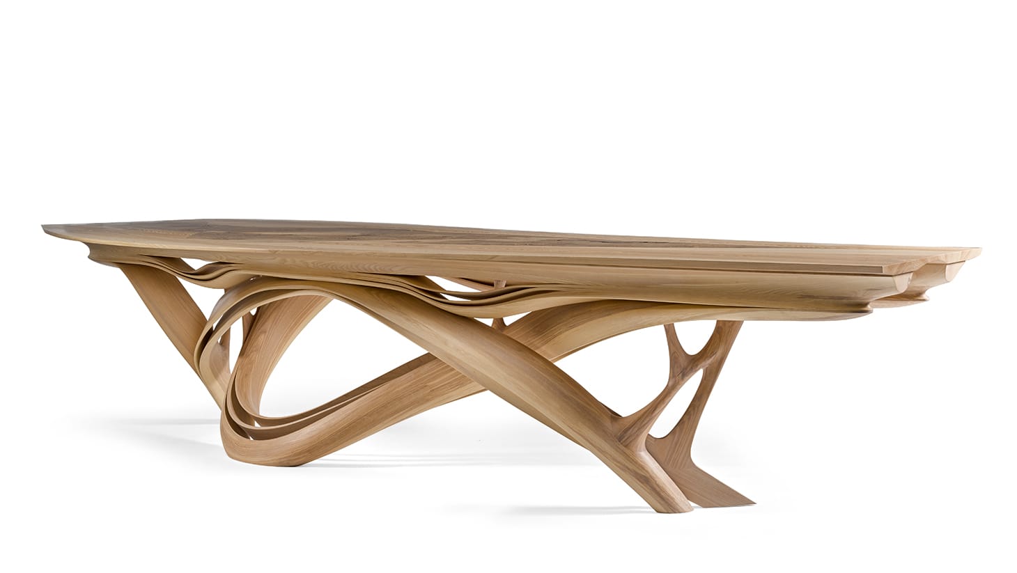 Joseph Walsh, unique "Enignum X" dining table with engraved copper plaque (2013), olive ash, burr olive ash, white oil, 29 1/2 x 141 3/4 x 57 1/8 inches, produced by Joseph Walsh, County Cork, Ireland (image courtesy Sotheby's)