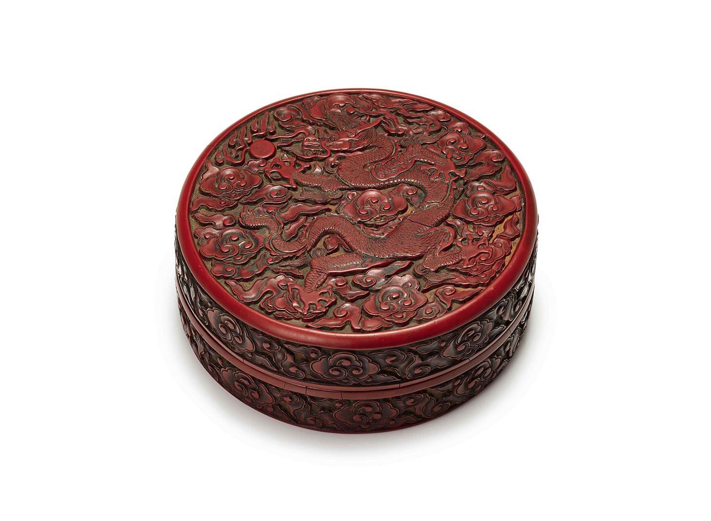 An important imperial cinnabar lacquer "Dragon" box and cover, incised mark and period of Yongle, 6 1/2 inches (image courtesy Sotheby's)