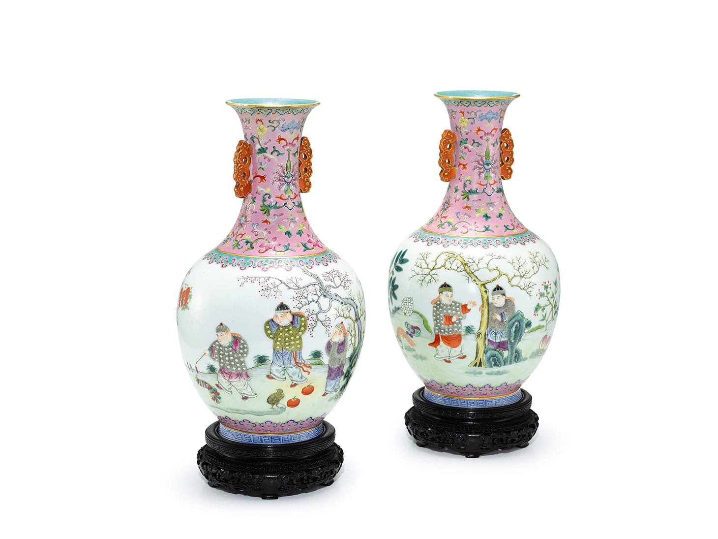 A rare pair of pink-ground famille-rose "Boys and Firecrackers" vases. Shendetang Hall Marks, Qng Dynasty, Daoguang period, each well-potted with an ovoid body rising from a short splayed foot to a tall waisted neck and flaring rim, the neck flanked by a pair of stylized dragon handles with gilt highlights, the exterior of the body enameled with a continuous scene, depicting five boys dressed in lavish winter clothing and lighting firecrackers in a garden laden with ripe fruits and lingzhi, all between a pink-ground and a turquoise-ground ruyi-band, the neck decorated with lotus scrolls and bats against a pink ground, the interior and base enameled turquoise, the base inscribed in iron-red with a four-character Shendetang zhi hall mark, wood stands, 11 3/4 inches (image courtesy Sotheby's)