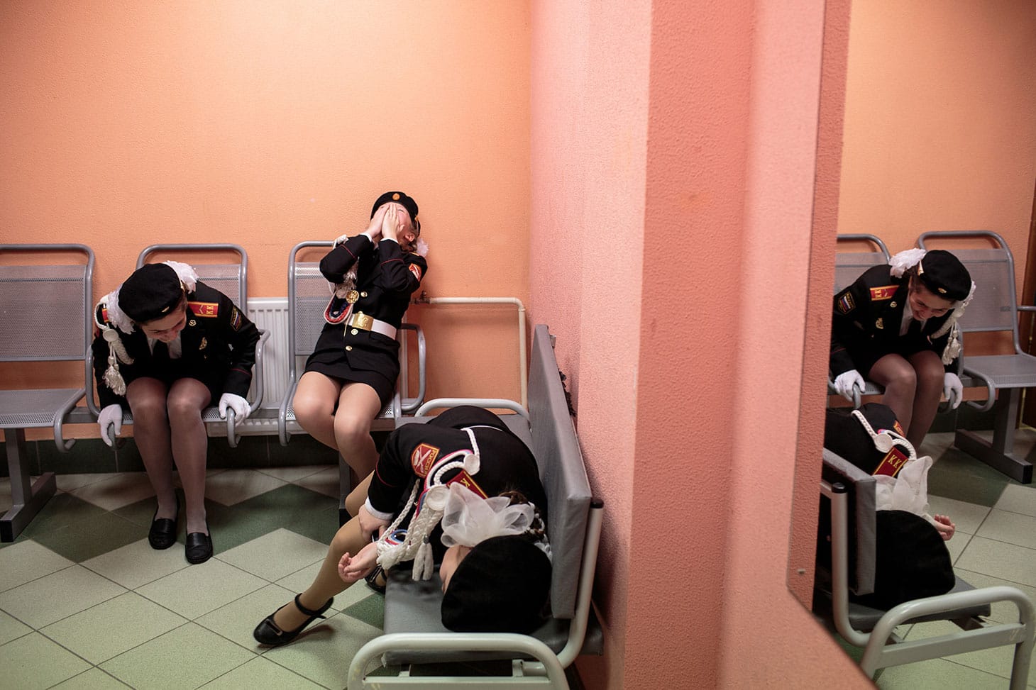Sarah Blesener, "Beckon Us From Home" (2018): Students laugh backstage before a singing and marching competition, at School #6 gymnasium, Dmitrov, Russia (© Sarah Blesener)