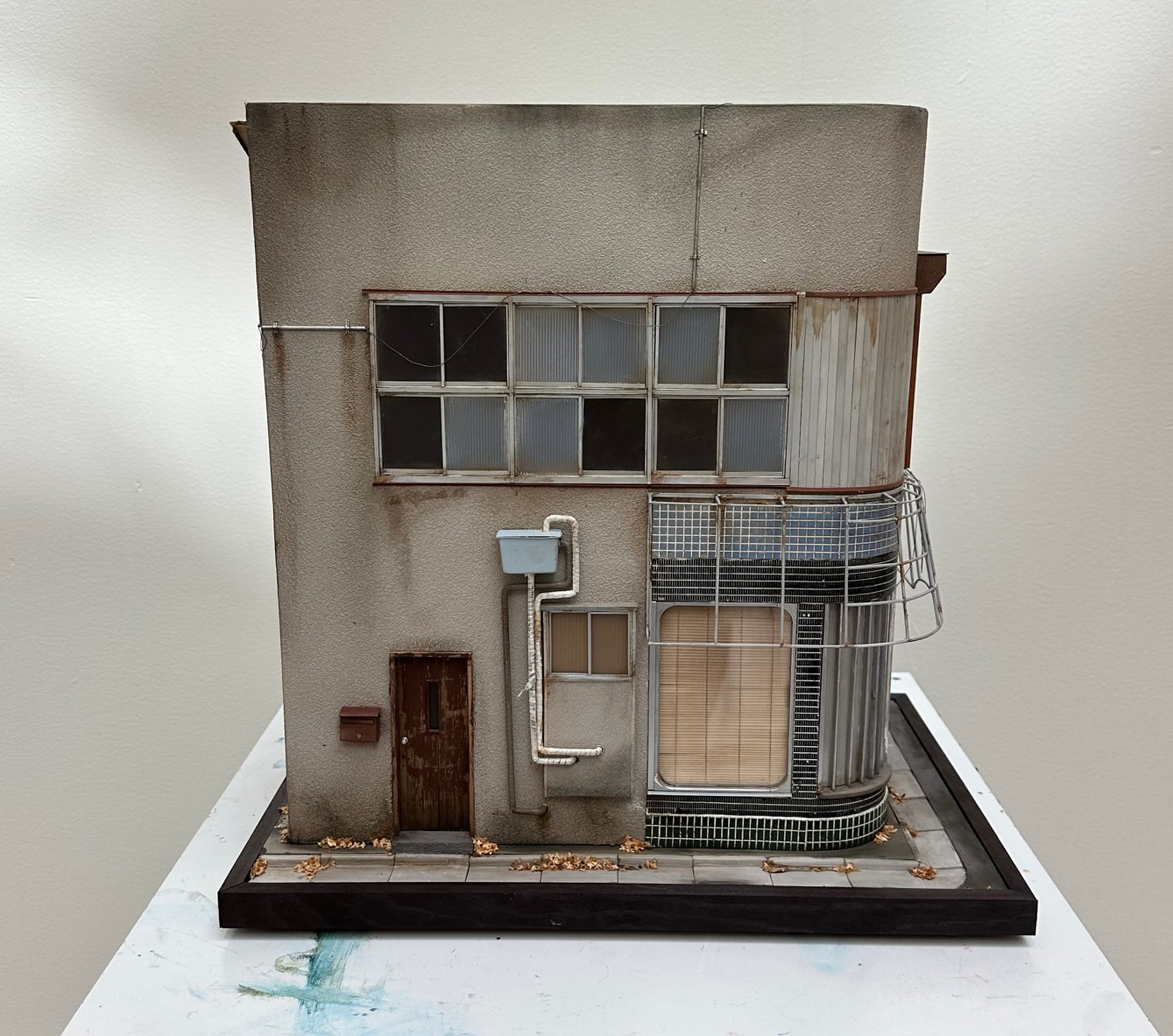 A recently completed miniature work by Christopher Robin Nordström, a freelance designer and artist who replicates buildings in Tokyo that he finds on Google Maps. (all images courtesy the artist, composites by Hyperallergic)
