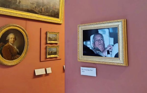 Activists Hang Prince Andrew's Arrest Photo at the Louvre