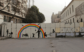 Street Artist Paints Away a Wall in Tahrir Square