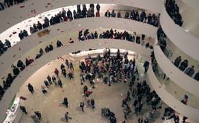 Protesters Rain Down Thousands of Bills in Guggenheim Rotunda