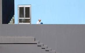 Humans Swallowed by the Extreme Geometry of Architecture