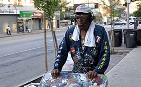 A Ladder, a Gate, and a Paintbrush: The Picasso of Harlem Returns to 125th Street