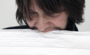 A Performance Artist Draws with His Teeth