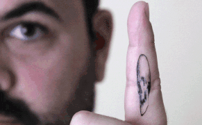 Hans Holbein's Anamorphic Skull as a Temporary Tattoo