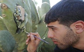 An Artist Paints Hopeful Portraits of Palestinians on Cactus Pads