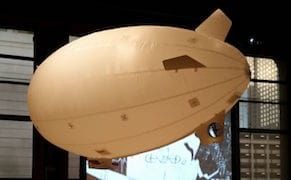 A Blimp Floats in a Gallery, Imagining the View from Space