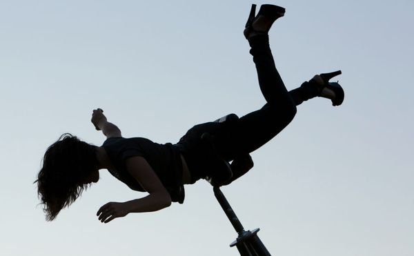 An Acrobat Embodies the Weightless Beauty Before a Fall