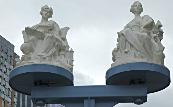 Gilded Age Statues Return to the Manhattan Bridge, Now with Kinetic Illumination