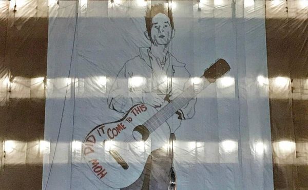 Woody Guthrie and His Fascist-Killing Guitar Projected on Oklahoma State Capitol