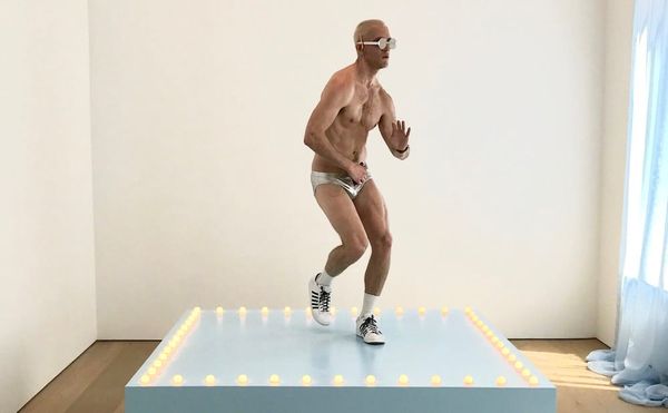 Felix Gonzalez-Torres, "Untitled" (Go-Go Dancing Platform) (1991), wood, light bulbs, acrylic paint, and Go-Go dancer in silv