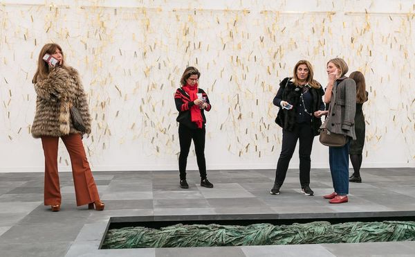 Installation view of Marian Goodman's booth at Frieze London 2017, with Leonor Antunes's bronze curtain sculpture in the back