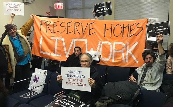 Protesters at a public meeting of New York City's Loft Board on January 18, 2018 unfurled a banner after the meeting conclude