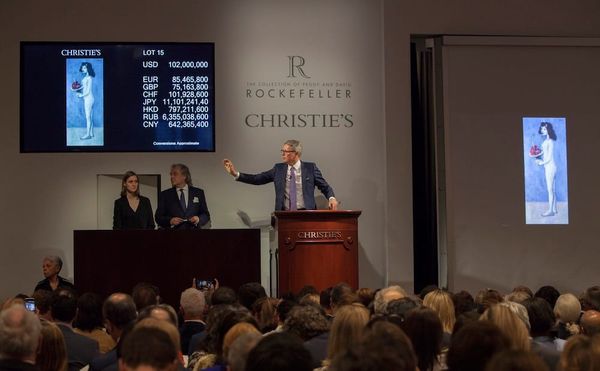 Christie's auctioneer Jussi Pylkkänen soliciting bids on Picasso's "Fillette à la corbeille fleurie" at the May 9 Rockefeller