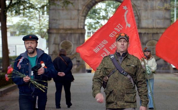 Flags, red carnations, and St. George ribbons are the accouterments of the revelers in Victory Day (2018)