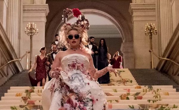 Helena Bonham Carter descends the Metropolitan Museum's main staircase in a scene from Ocean's 8 (image courtesy of Warner Br