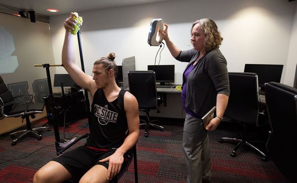 College Basketballer Poses to Lend an Ancient Roman Statue an Arm