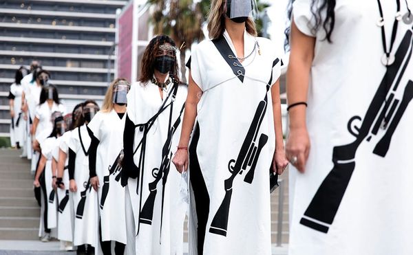 Outfitted With Symbolic Rifles, Female Collective Raises Awareness for a Largely Ignored War