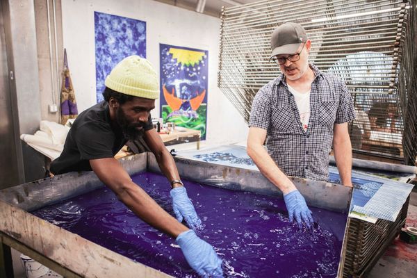 Artist Ivan Forde and Powerhouse Arts Printshop Director Luther Davis creating a print together in the studio.