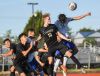 Canby’s Joe Thompson and Gresham’s Joel Gonzalez go into the air to play a header during a preseason match.